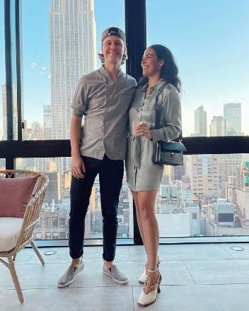 Danielle Olivera wearing silver color one piece.